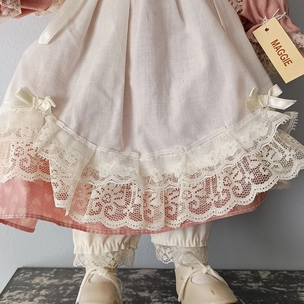 Vintage Porcelain Doll with Pink Dress and Bonnet by Dynasty Dolls